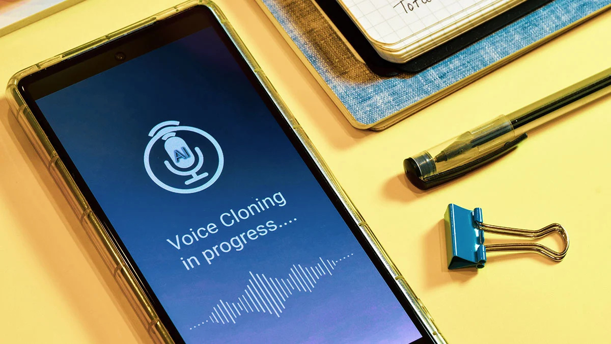Smartphone screen displaying voice cloning in progress.